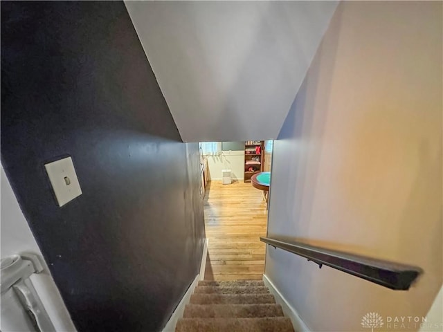 stairs with wood-type flooring