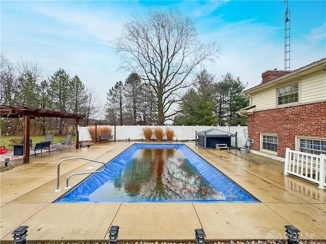 view of pool with a patio area and a pergola