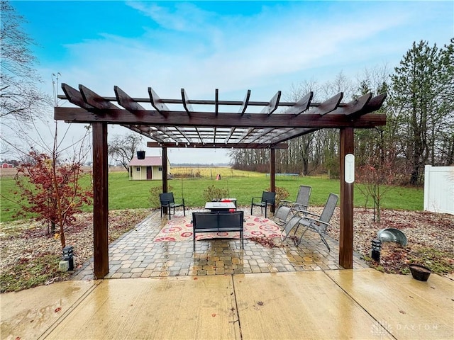 view of patio with a pergola and an outdoor structure