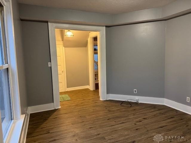 spare room featuring dark hardwood / wood-style floors