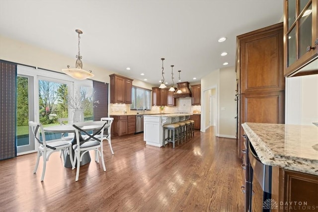 dining space with dark hardwood / wood-style flooring