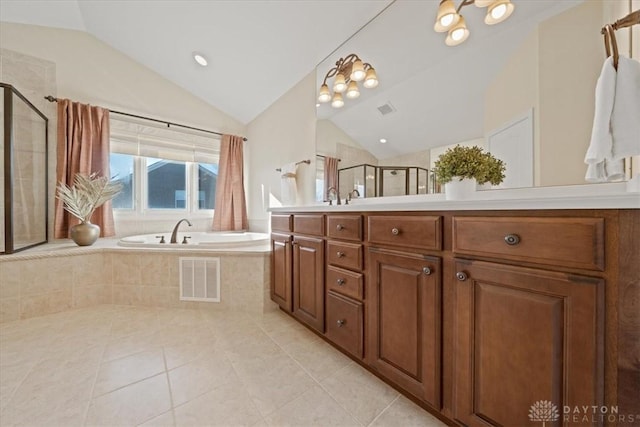 bathroom featuring tile patterned flooring, vanity, plus walk in shower, and vaulted ceiling