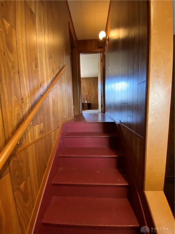 stairway with wooden walls