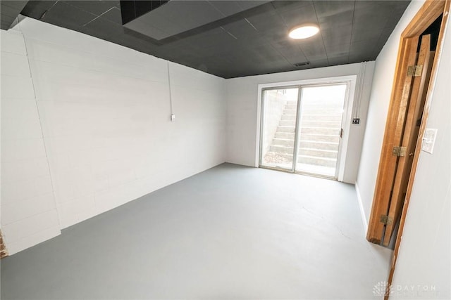 spare room with concrete flooring