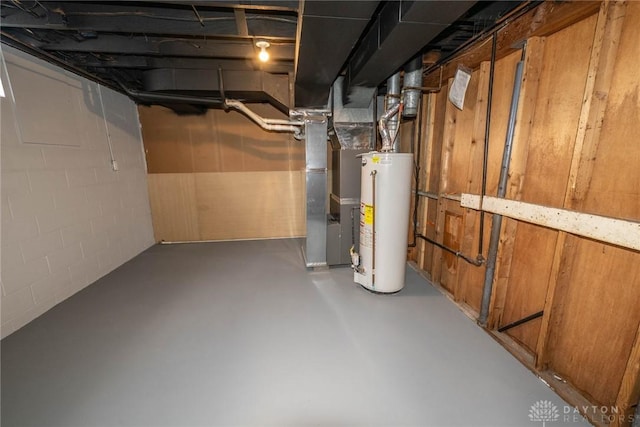 basement featuring heating unit and gas water heater