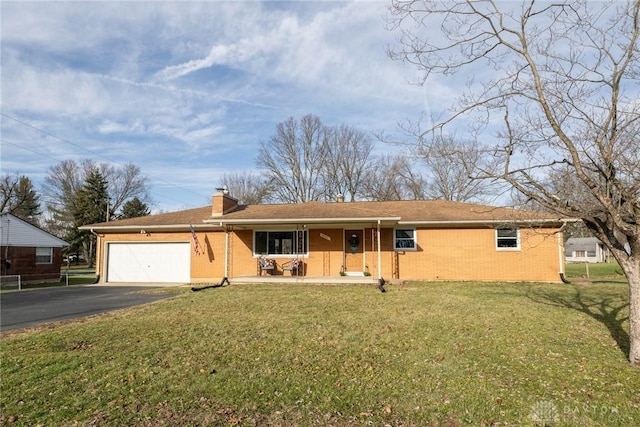 ranch-style home featuring a garage and a front yard