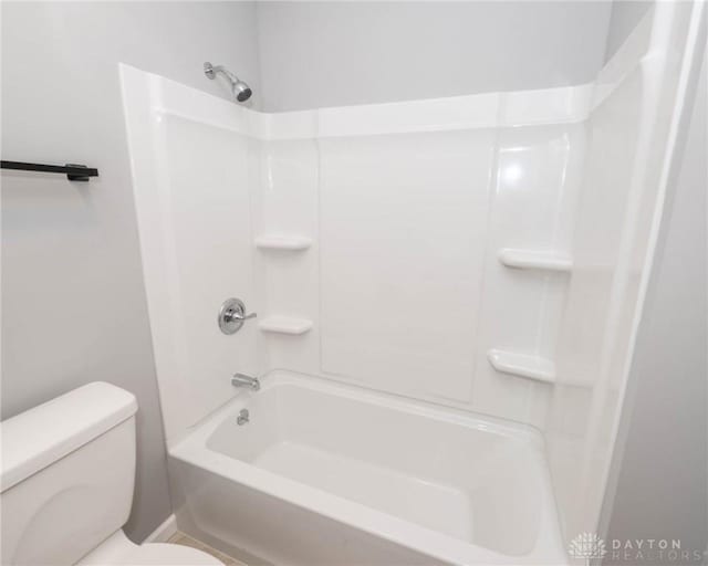 bathroom featuring  shower combination and toilet