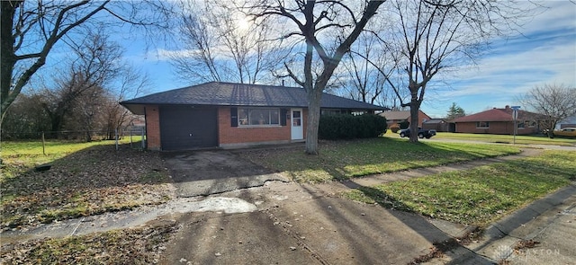 view of front of home featuring a garage and a front lawn