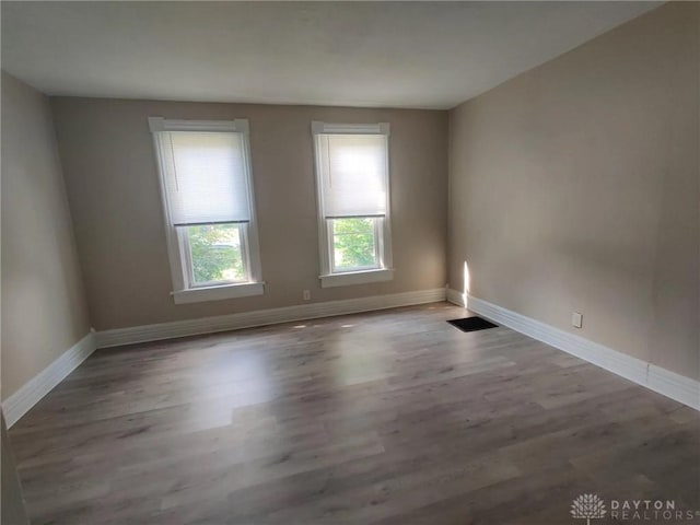 unfurnished room featuring light hardwood / wood-style floors