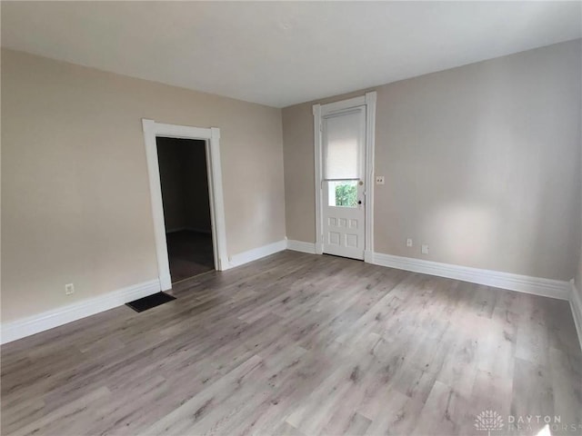 unfurnished room featuring light hardwood / wood-style flooring