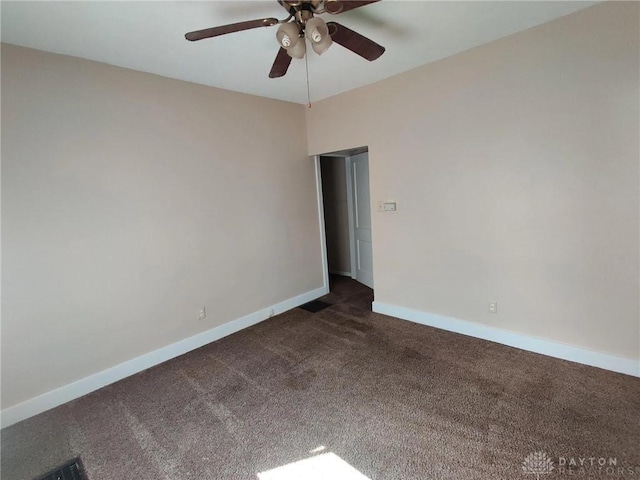 carpeted empty room featuring ceiling fan