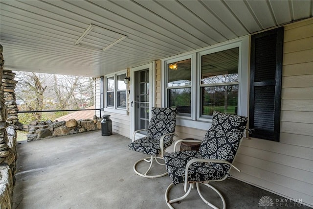 view of patio featuring a porch