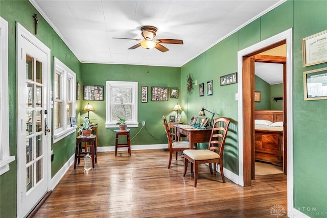 sitting room featuring hardwood / wood-style floors and ceiling fan