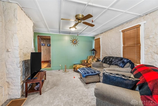 living room with ceiling fan and carpet floors