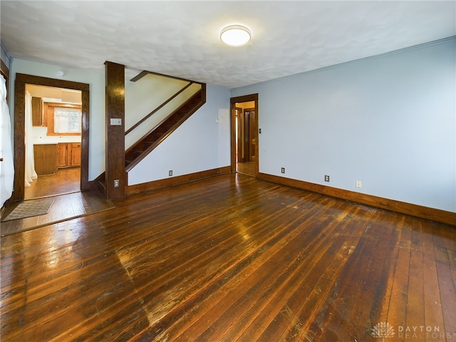 spare room with dark wood-type flooring