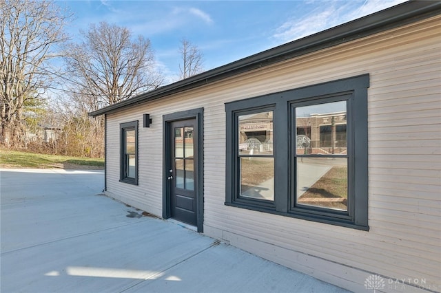 view of side of property with a patio area