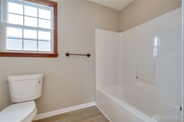 bathroom featuring hardwood / wood-style flooring and toilet