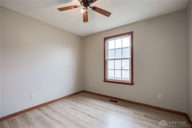 spare room featuring light hardwood / wood-style floors and ceiling fan