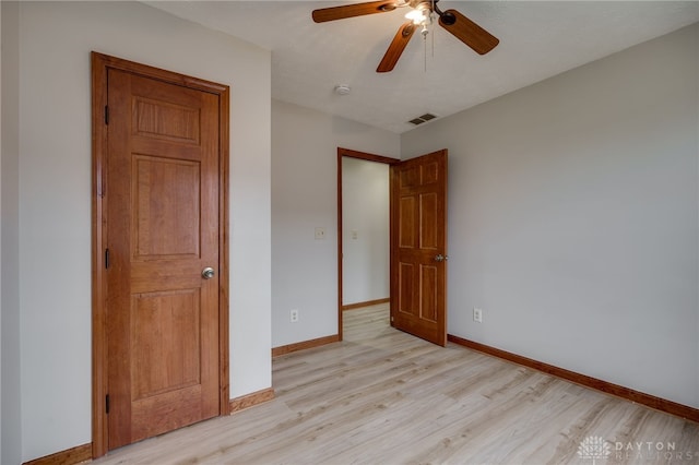 unfurnished bedroom with light hardwood / wood-style flooring and ceiling fan