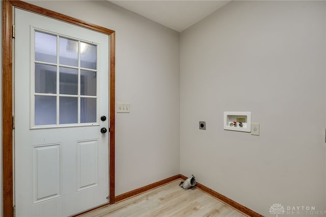 laundry area with washer hookup, electric dryer hookup, and light hardwood / wood-style floors