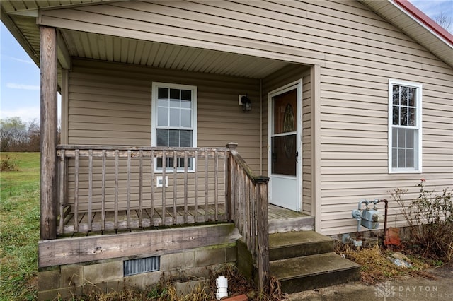 doorway to property featuring covered porch