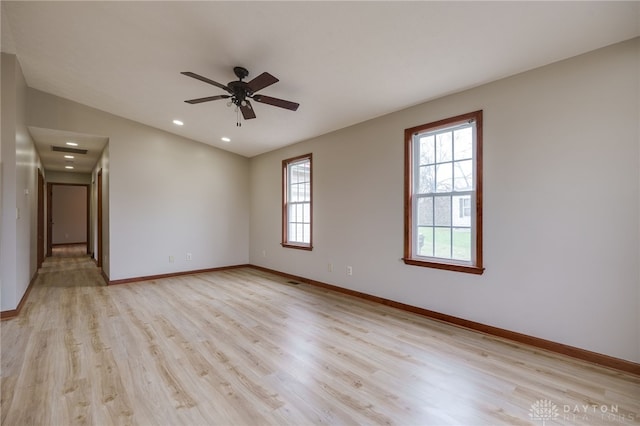 spare room with light hardwood / wood-style flooring and ceiling fan