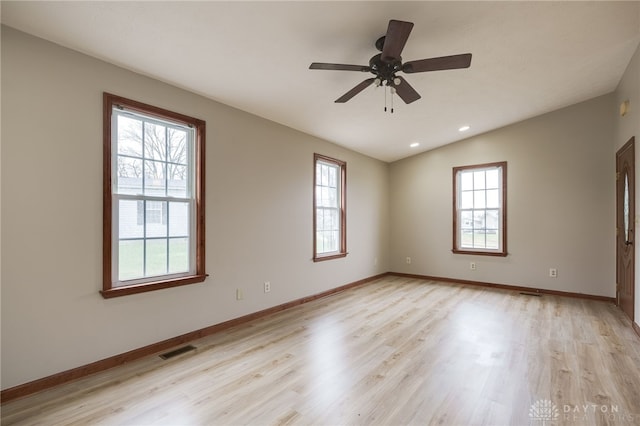 unfurnished room with light hardwood / wood-style flooring, ceiling fan, and lofted ceiling