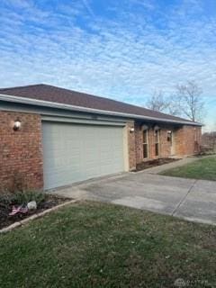 view of home's exterior with a lawn and a garage