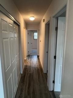 corridor with dark hardwood / wood-style floors