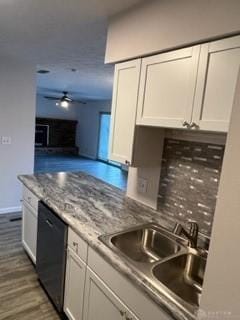 kitchen with dishwasher, white cabinets, sink, ceiling fan, and dark hardwood / wood-style flooring