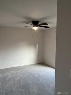 empty room featuring carpet flooring and ceiling fan