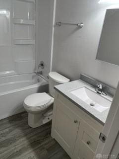 full bathroom with vanity, toilet, shower / bathing tub combination, and hardwood / wood-style flooring