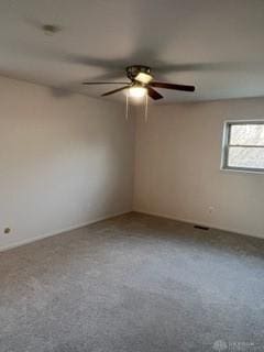 carpeted empty room featuring ceiling fan