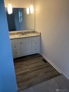 bathroom featuring wood-type flooring and vanity