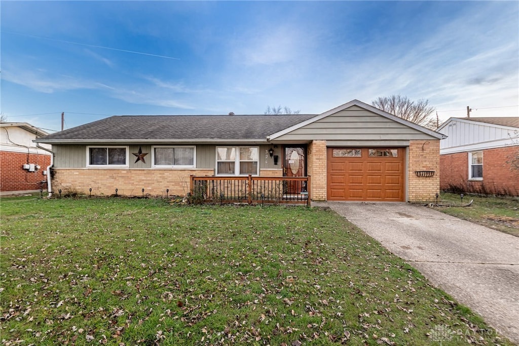 ranch-style home with a front yard and a garage