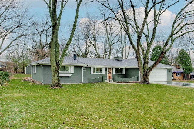 ranch-style home with a garage and a front yard