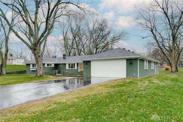 view of property exterior featuring a lawn and a garage