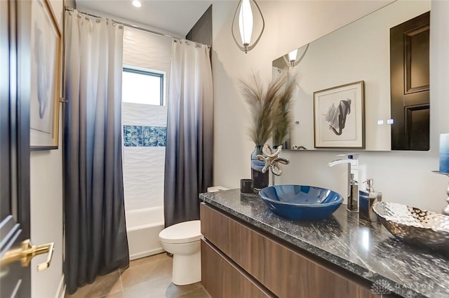 full bathroom with tile patterned flooring, vanity, toilet, and shower / tub combo with curtain