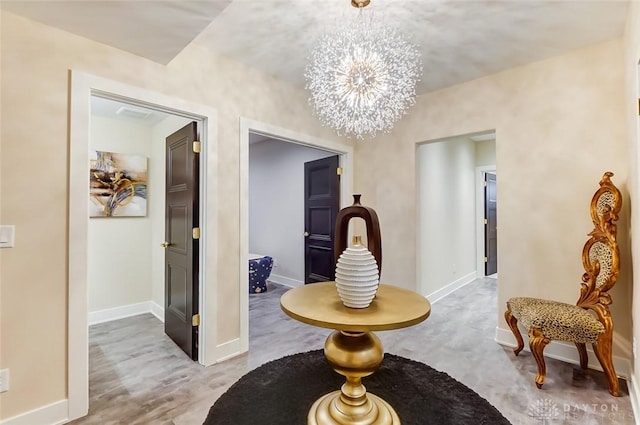 hallway featuring a chandelier and wood-type flooring