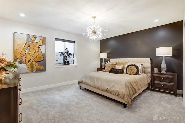 bedroom featuring light carpet and a chandelier