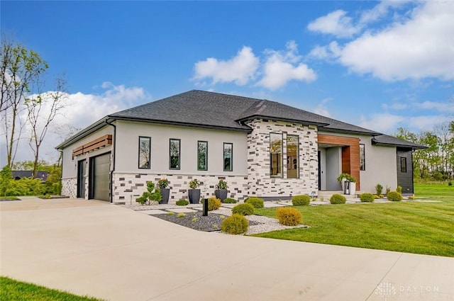 view of front of house featuring a garage and a front yard