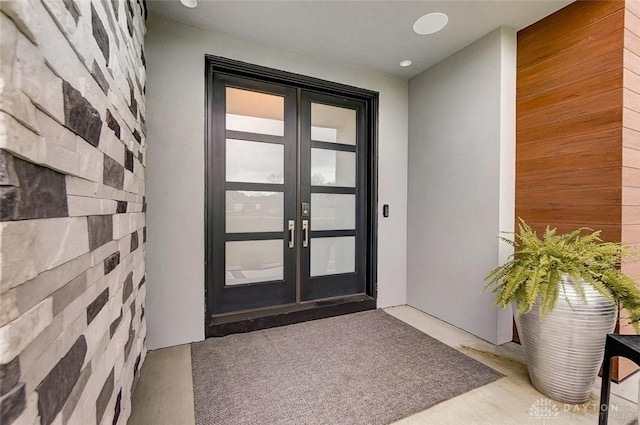 view of exterior entry featuring french doors