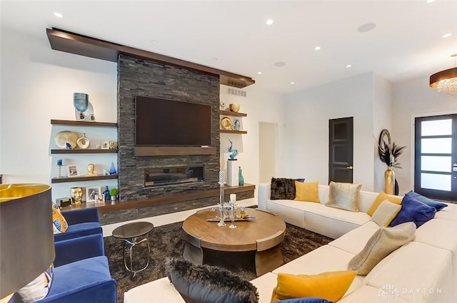 living room with a fireplace and hardwood / wood-style floors