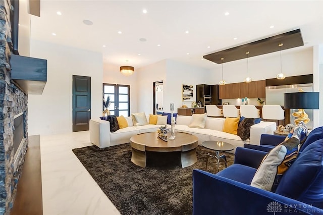 living room with a fireplace and french doors