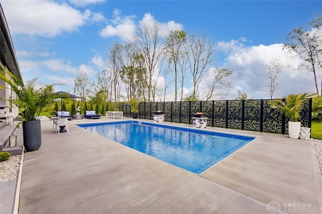 view of swimming pool with a patio