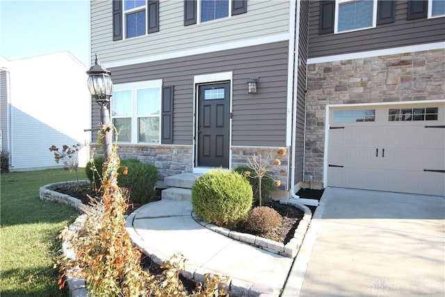 doorway to property with a garage