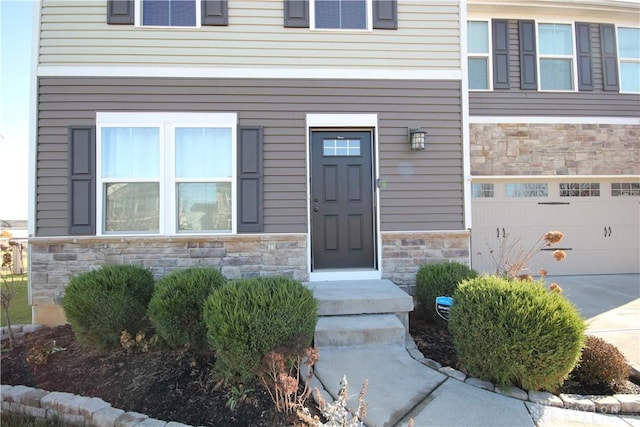 doorway to property featuring a garage