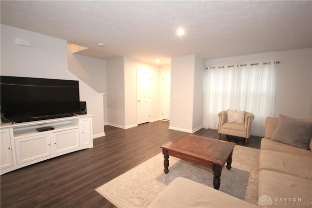 living room with dark hardwood / wood-style flooring