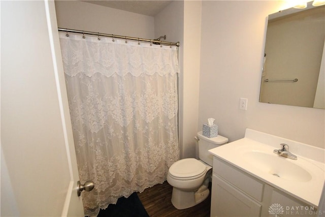 bathroom featuring vanity, curtained shower, toilet, and wood-type flooring