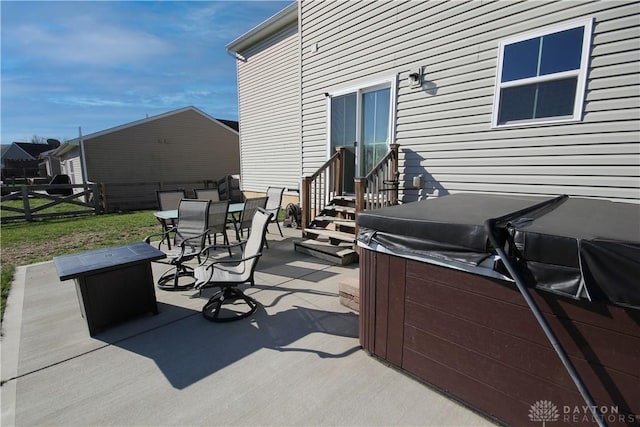 view of patio with a hot tub